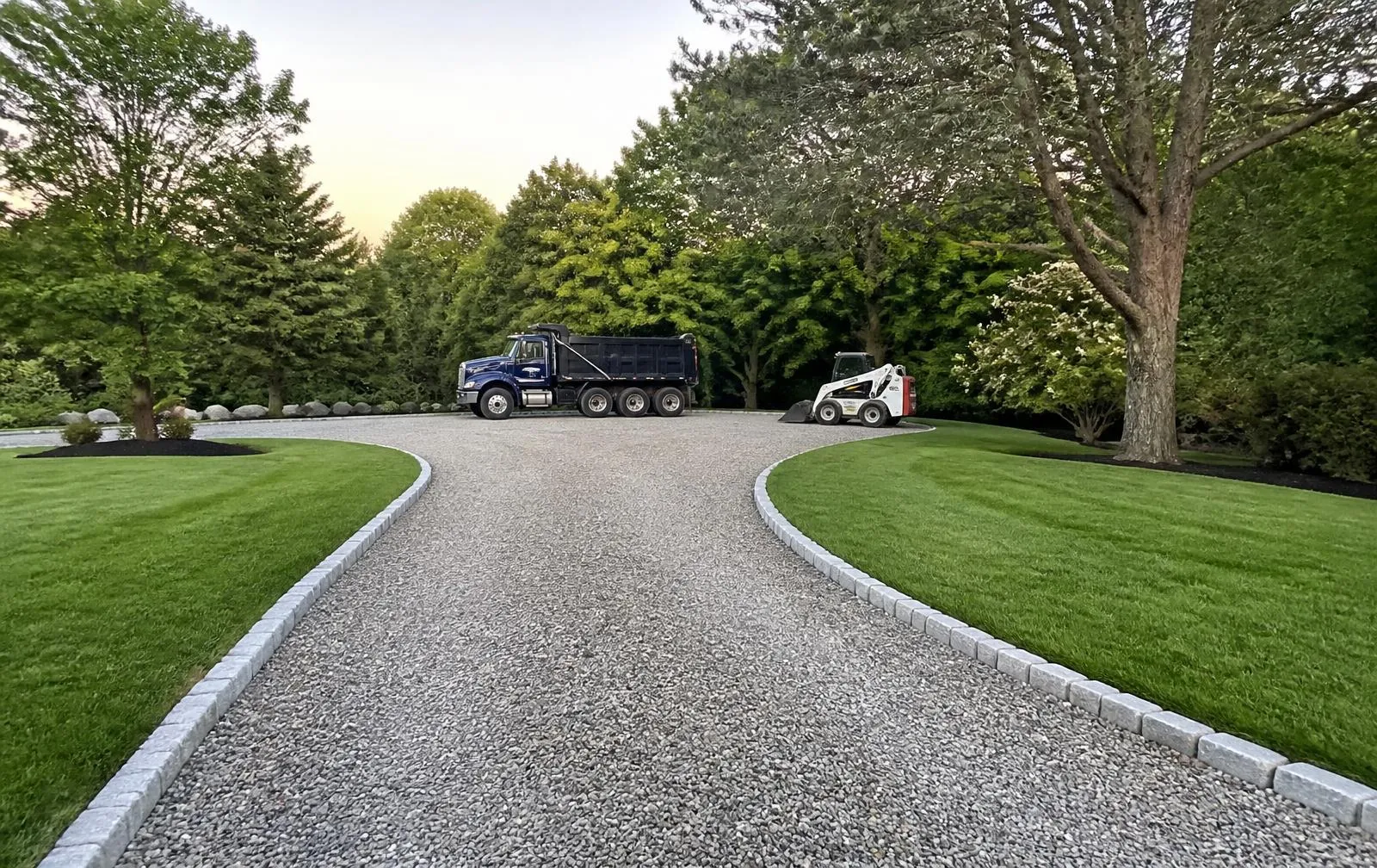 Gravel driveway with granite border at a Norfolk, MA property