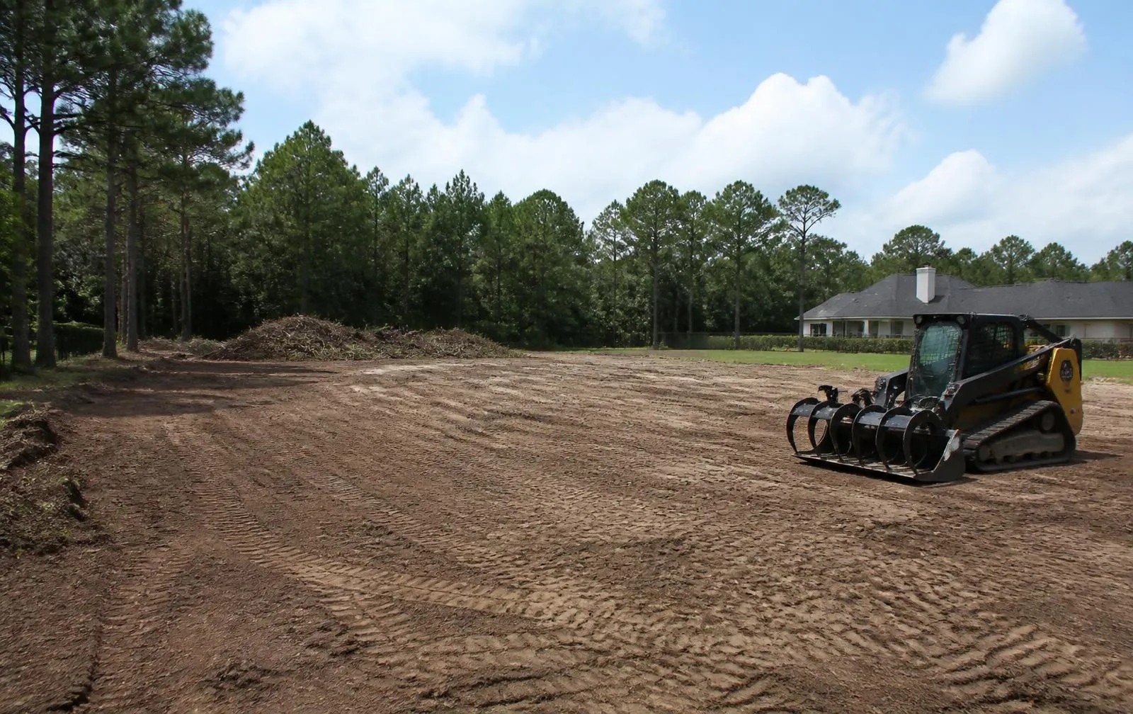 The same lot cleared and graded to open, usable land