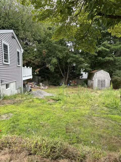 New Lawn & Retaining Wall With Built-In Staircase in Norfolk, MA by LD Landscape & Construction — photo 7