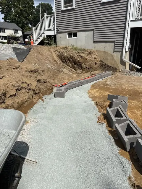 New Lawn & Retaining Wall With Built-In Staircase in Norfolk, MA by LD Landscape & Construction — photo 9